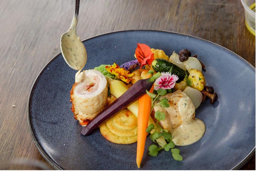 - 06 catered dish with lobster and vegetables