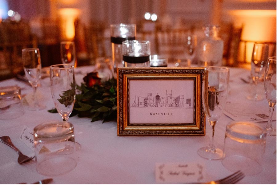 wedding reception table setting with framed picture of Nashville