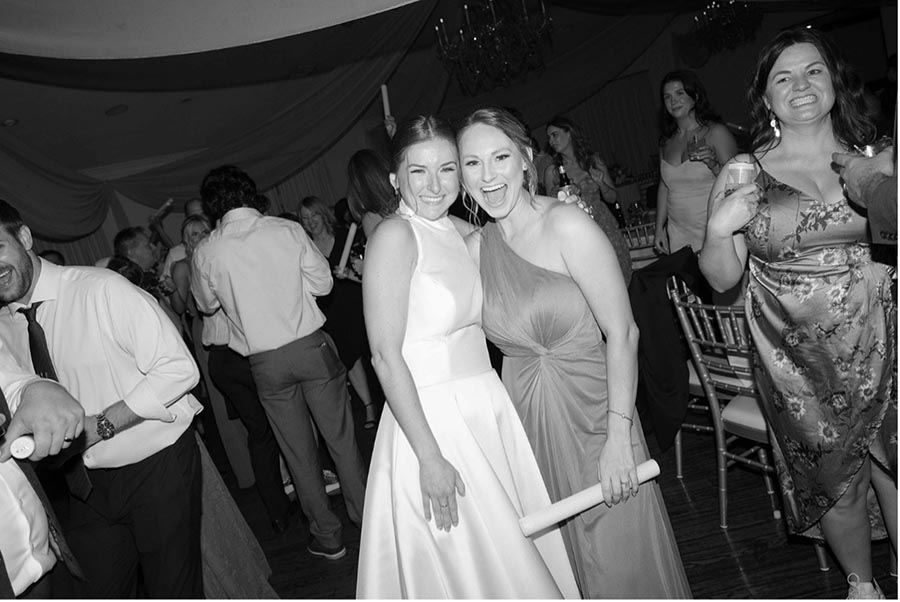 - 10 bride and best friend at her wedding reception