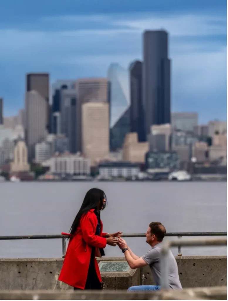 Chris proposing to Maria by the river