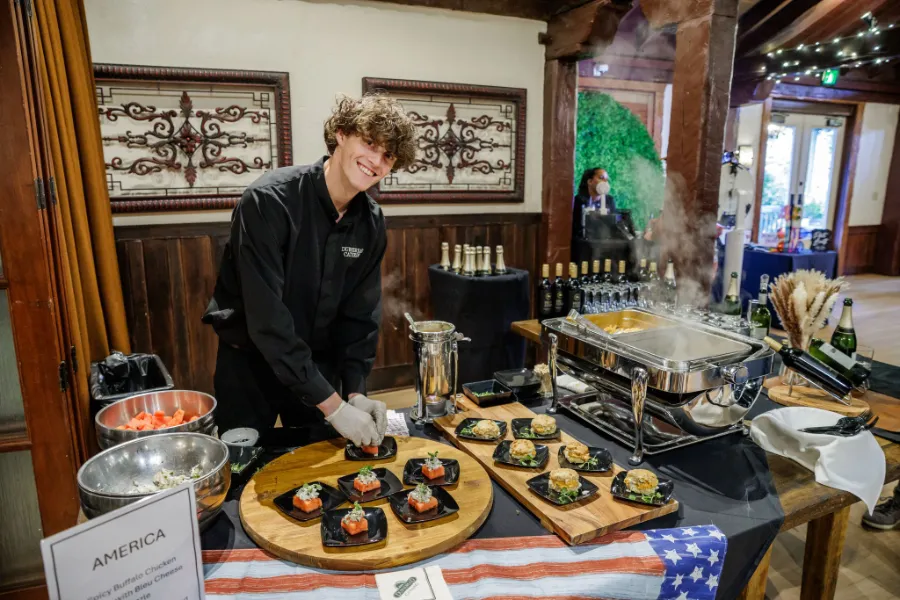 man prepping office catering station