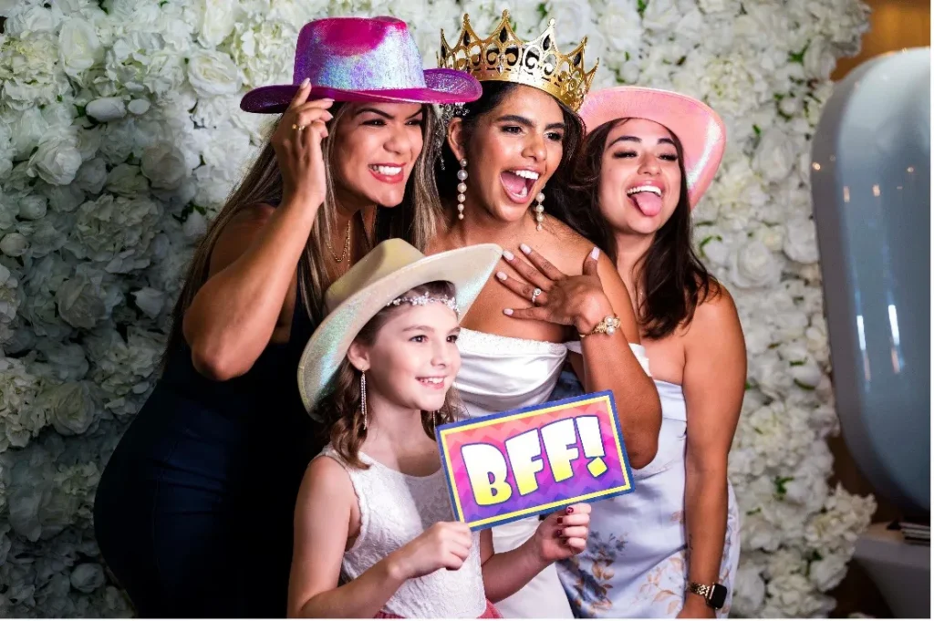 bride and friends posing with props