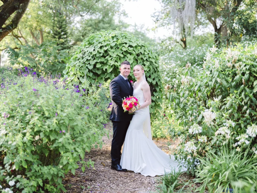 bride and groom standing in garden in Orlando