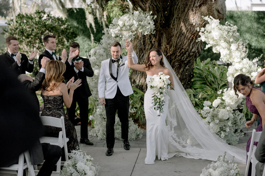 bride and groom walking down the aisle after their micro wedding