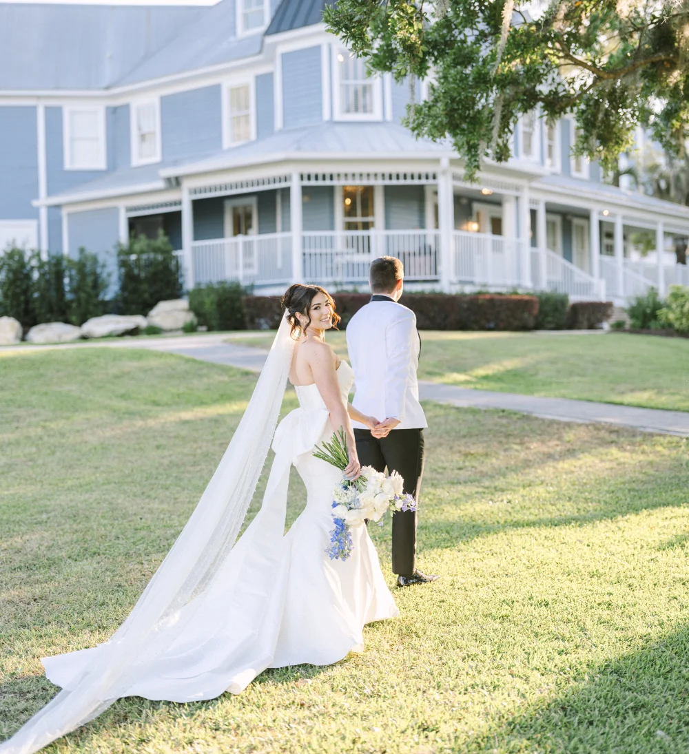 Bride and Groom walking to the Highland Manor wedding venue