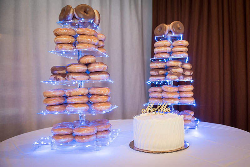 Wedding cake and tower of donuts.