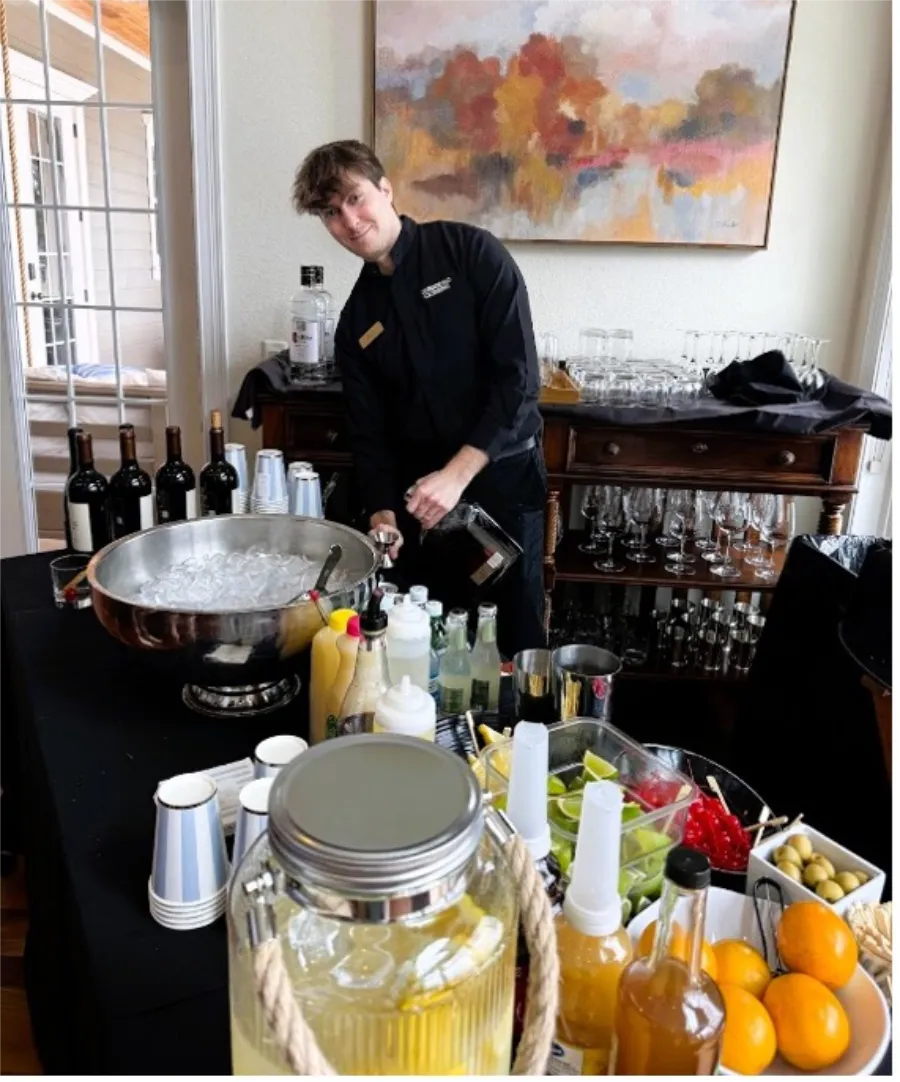 in home catering wine and drinks station with bartender