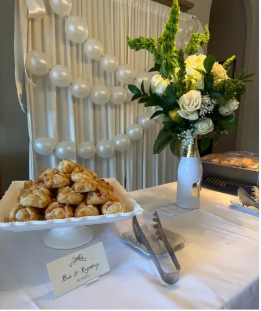 in home wedding catering table spread with flowers