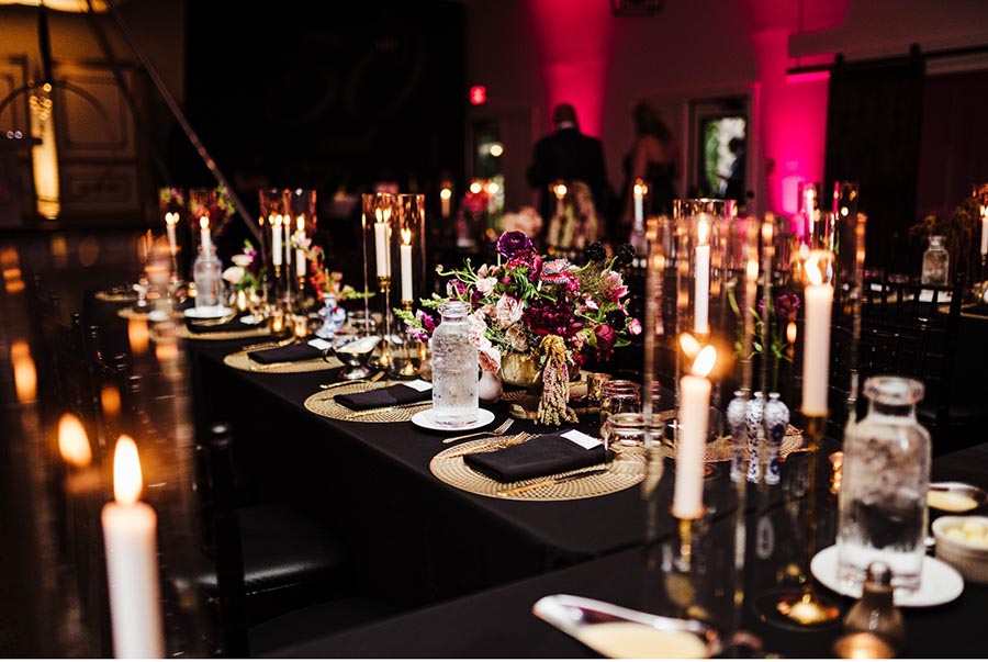 - wedding banquet hall table set for reception with candles and flowers