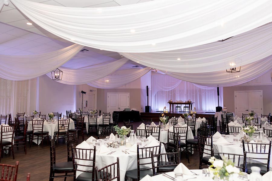 - wedding reception hall decorated in preperation for bride and groom