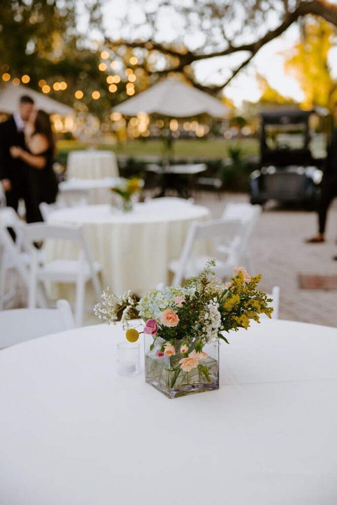wedding reception table flower centerpiece on outdoor patio
